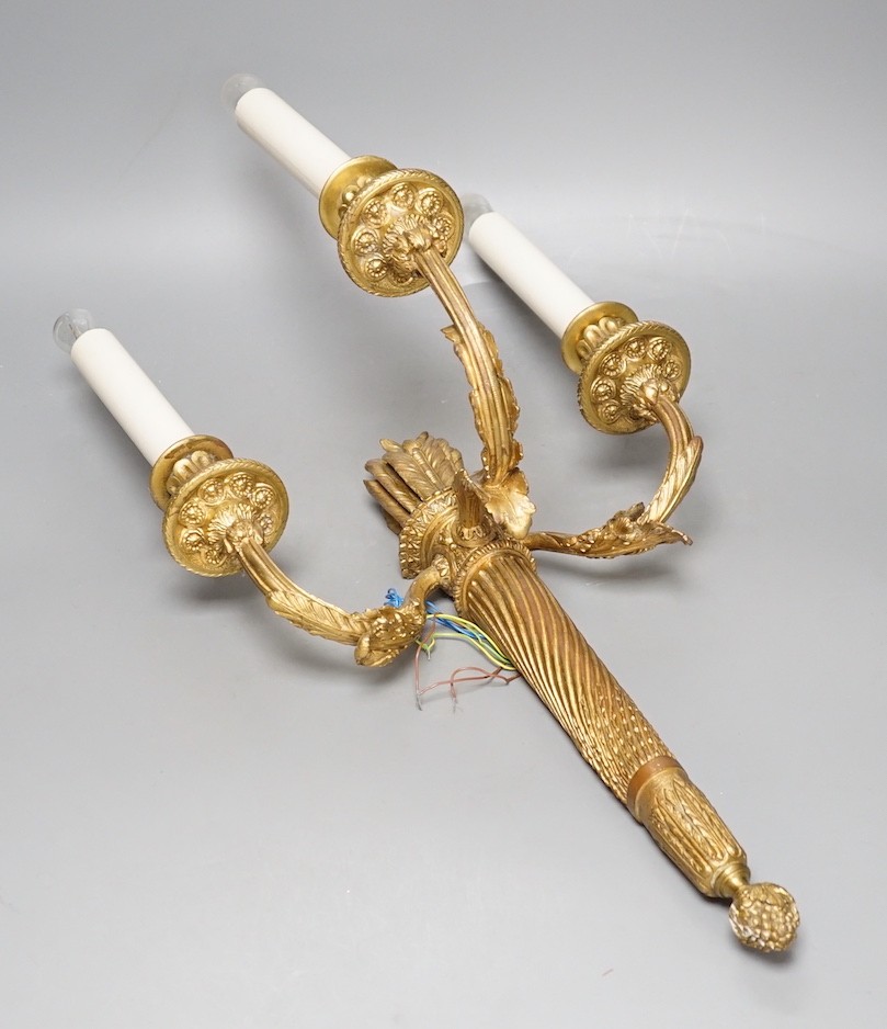 A Louis XVI style gilt bronze ‘bow and quiver’ three branch wall sconce - 59cm tall